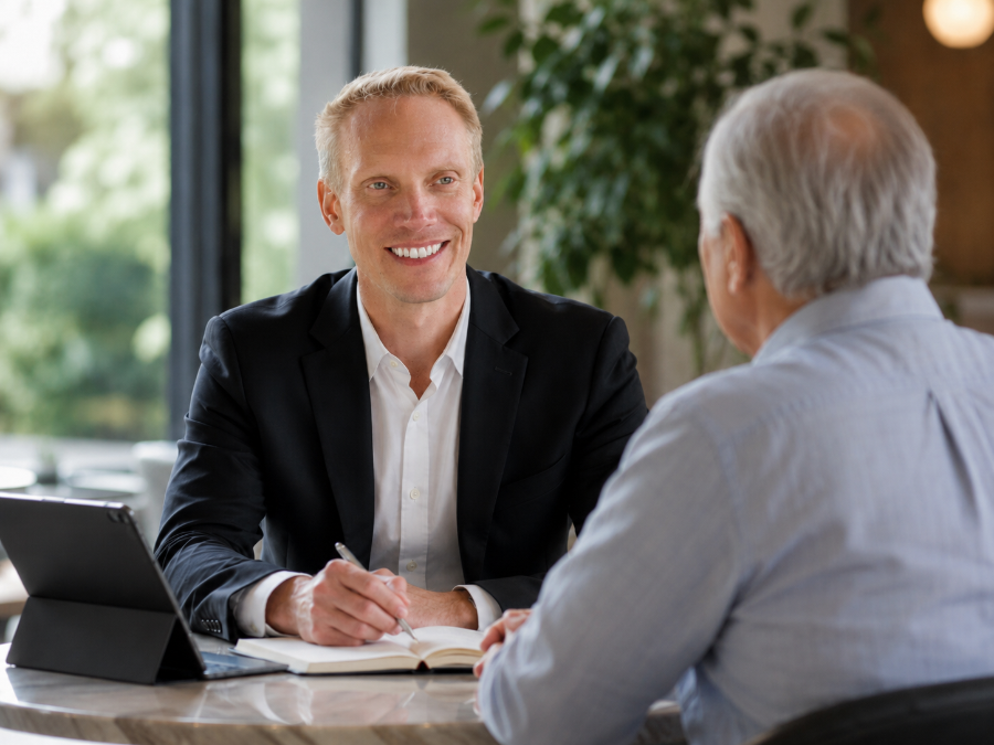 Financial advisor meeting with a client across a table